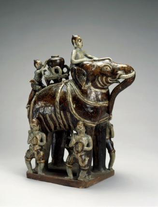 Elephant with riders and attendants