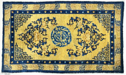 Rug with foliate designs flanking a medallion of dragons