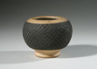 Water container with design in black slip and lead glaze