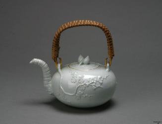 White teapot with a bamboo handle