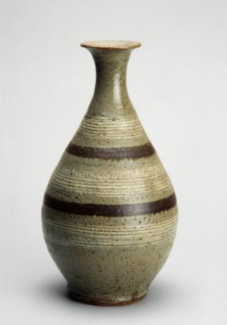 Elongated oval bottle with rope designs