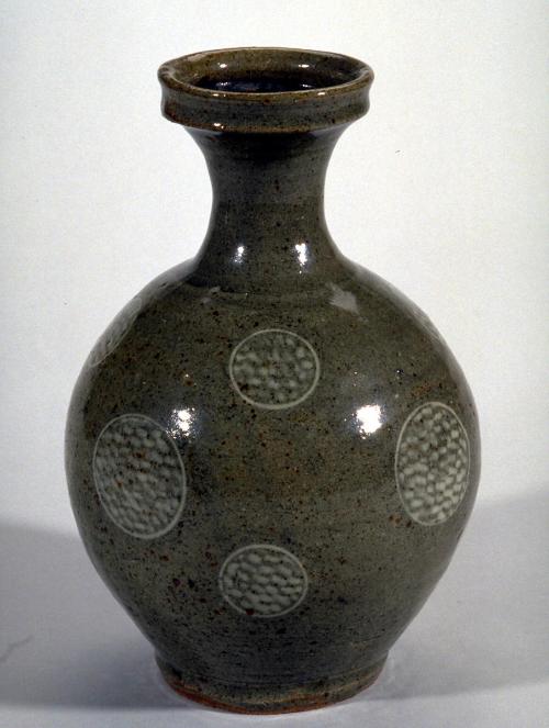 Bottle with round body and circle designs