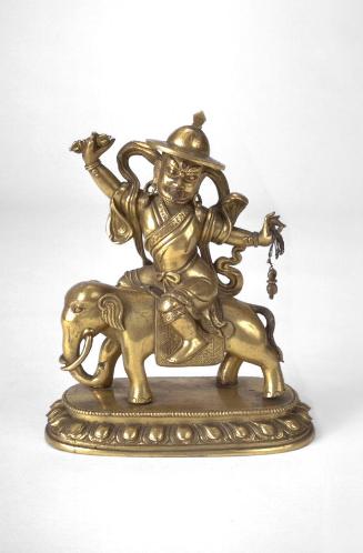 The Buddhist guardian Dam Chen riding an elephant