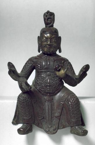 Seated guardian figure