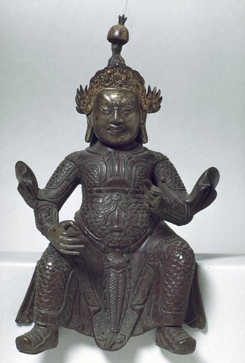 Seated guardian figure