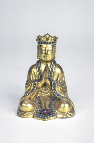 Seated worshipper, one of a pair