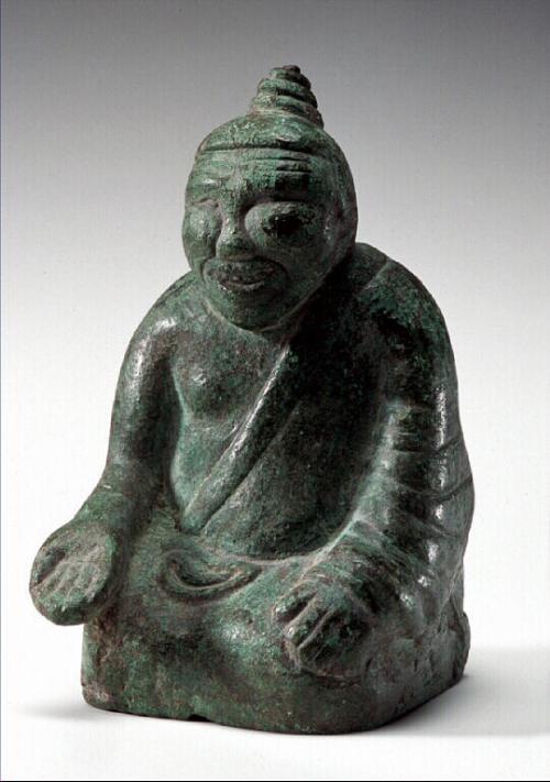 Seated figure, one of four