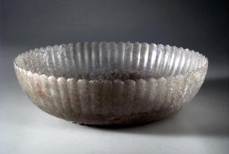 Shallow fluted bowl in the shape of a flower