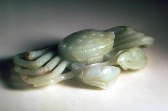 Box in the shape of a crab holding a sheath of grain