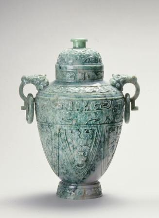 Vessel in an ancient bronze form with dragon-headed handles