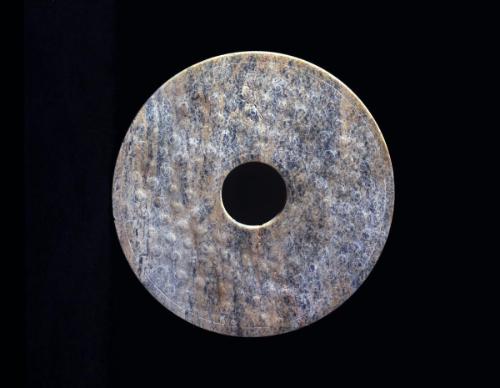 Disk with a design of relief clouds