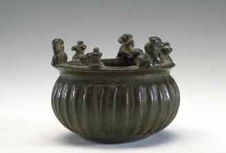 Ritual bowl with linga, Shiva's bull, and other figures