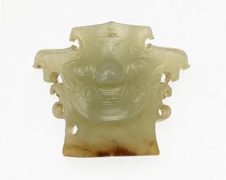 Ornament with monster-mask motif