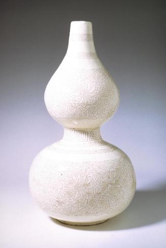 Gourd shaped vase with lotus, one of a pair