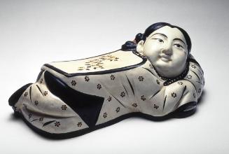 Pillow in the form of a reclining girl