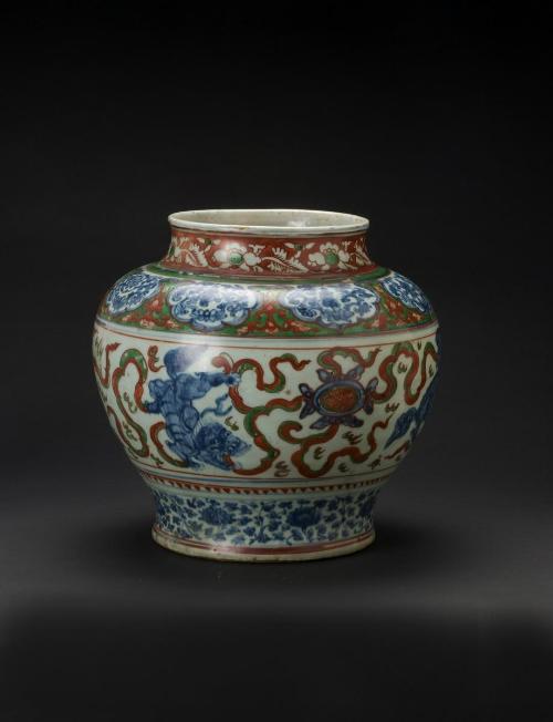 Jar with design of lions playing with a ball