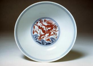 Shallow bowl with design of dragons, one of a pair