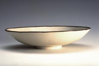 Shallow bowl with design of fish in a lotus pond