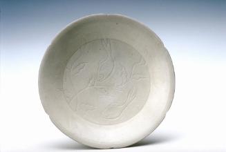 Shallow dish depicting a fish pond