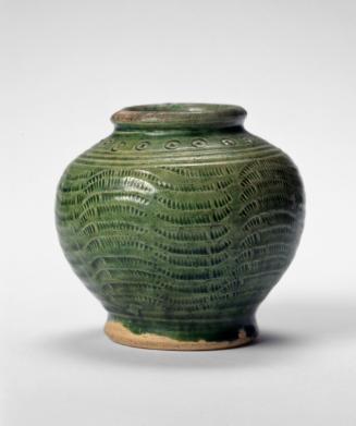 Jar with a frieze of circles and incised comb pattern