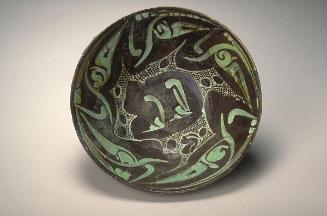 Bowl with abstract designs and foliate patterns