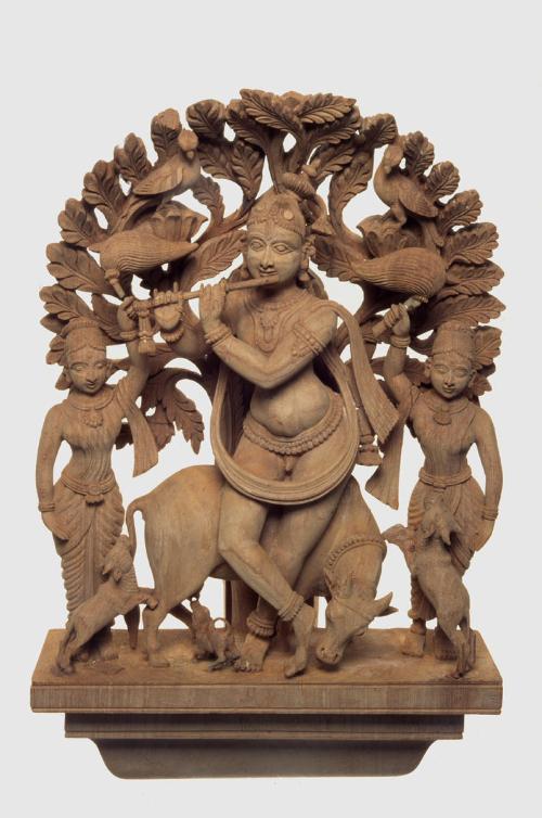 Krishna as a cowherd playing the flute