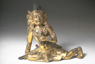 Seated figure, one of a pair