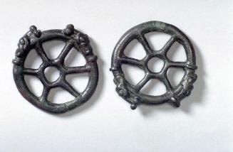 Cheek pieces of a horse bit in the form of wheels