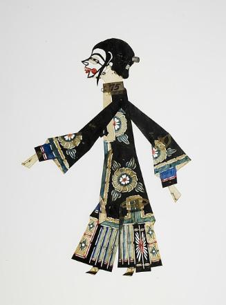 Female clown or comedian figure in black robe with floral motifs