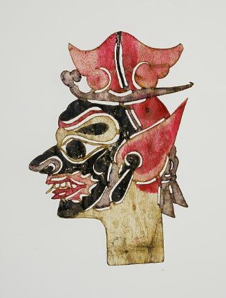 Black-faced head with red pointed ears and red hat