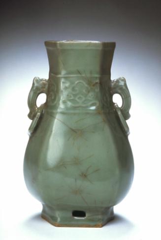 Hexagonal vase with animal-mask motifs