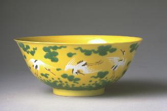 Bowl with design of eight cranes flying through clouds