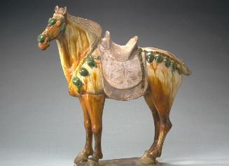 Horse with brown saddle