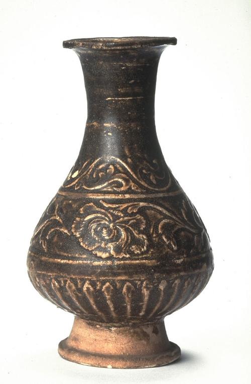 Vase with floral scrolls in low relief