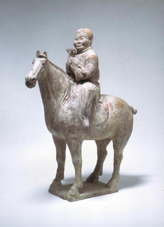 Horse with hunter holding a hound in his arms, one of a pair