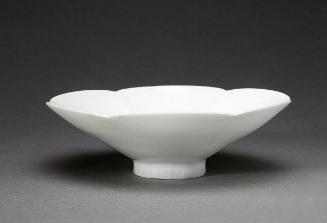 Footed scalloped saucer, one of a pair