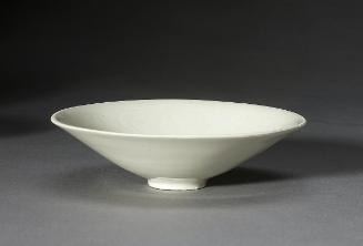 Deep saucer with flaring sides, one of a pair