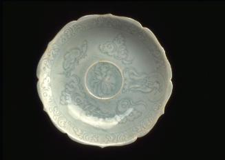 Saucer with lotus blossom and a figure of an immortal amid clouds