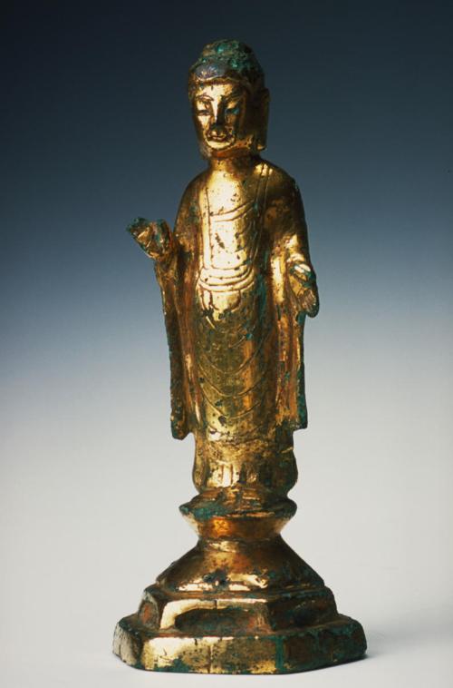 Standing Buddha on lotus pedestal