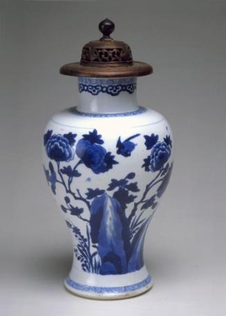 Vase with butterfly and flowers