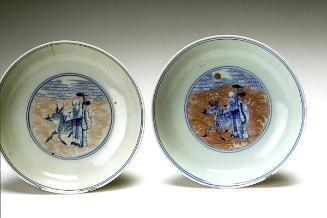 Dish with a depiction of the god of longevity crossing ocean, one of a pair