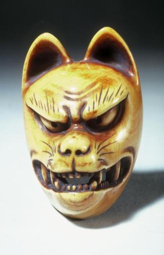 Mask of a Fox Baring Fangs