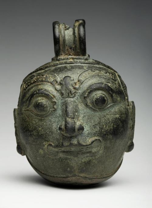 Bell in the shape of a grotesque head