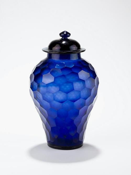 Covered jar with facets