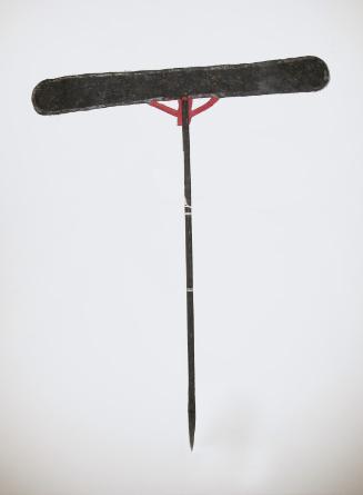 A prop (black stick)