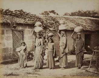 BHEEL WOMEN CARRYING WATER. KATHIAWAR.