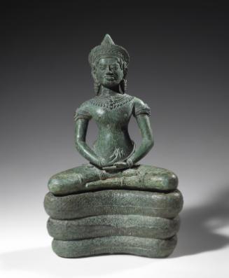 Crowned and bejeweled serpent-enthroned Buddha