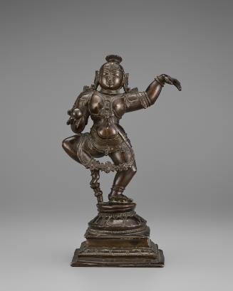 The Boy Krishna holding a stolen butterball and dancing