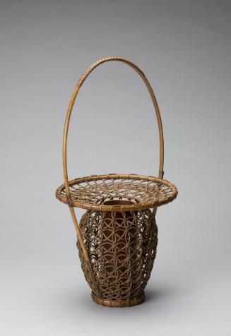 Plaited rattan flower basket with handle