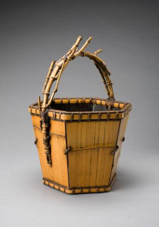 Flower basket in the shape of a bucket